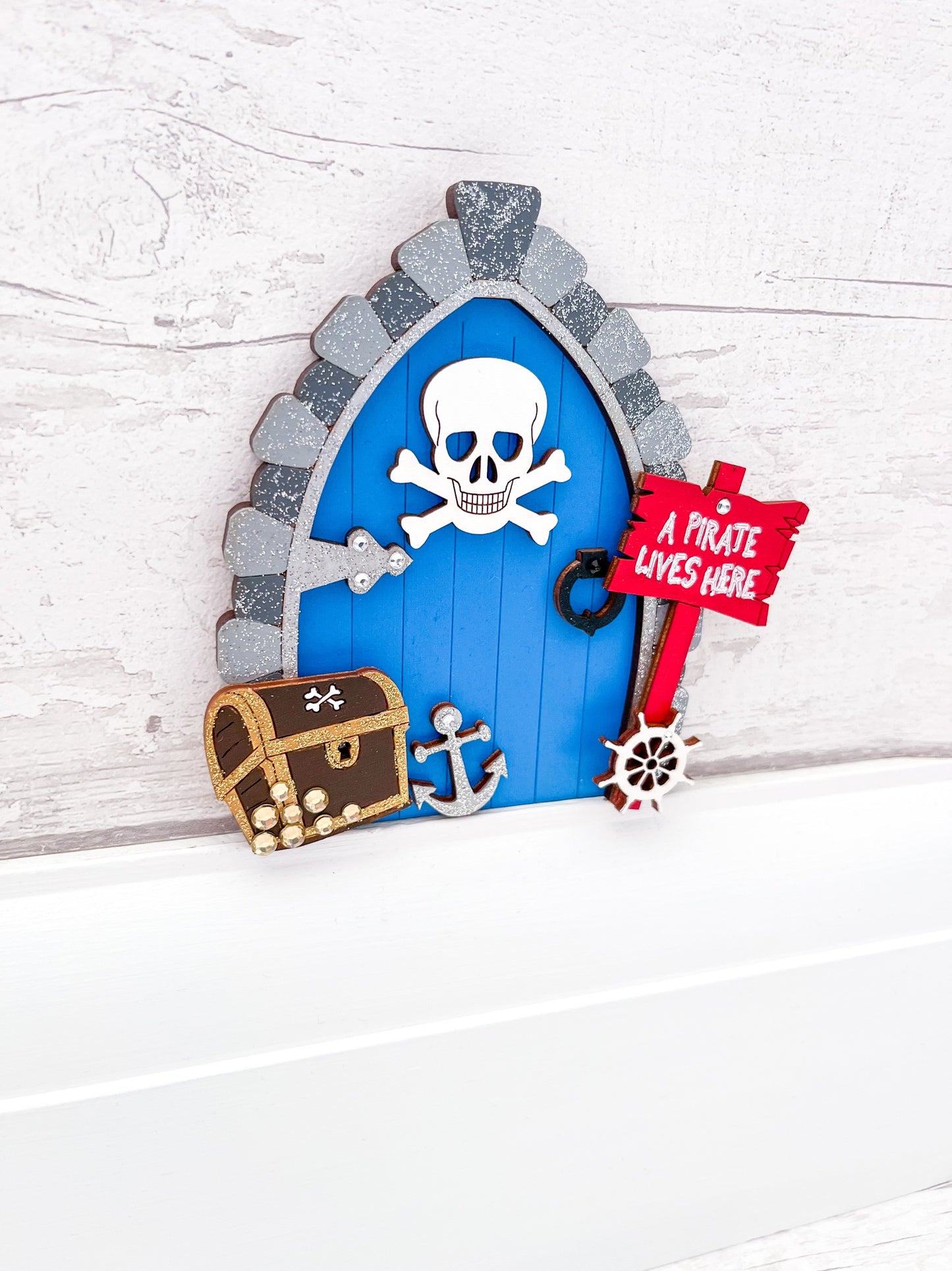 Handcrafted wooden fairy door with a pirate twist, perfect for adventurous little ones - Sweet Pea Wooden Creations