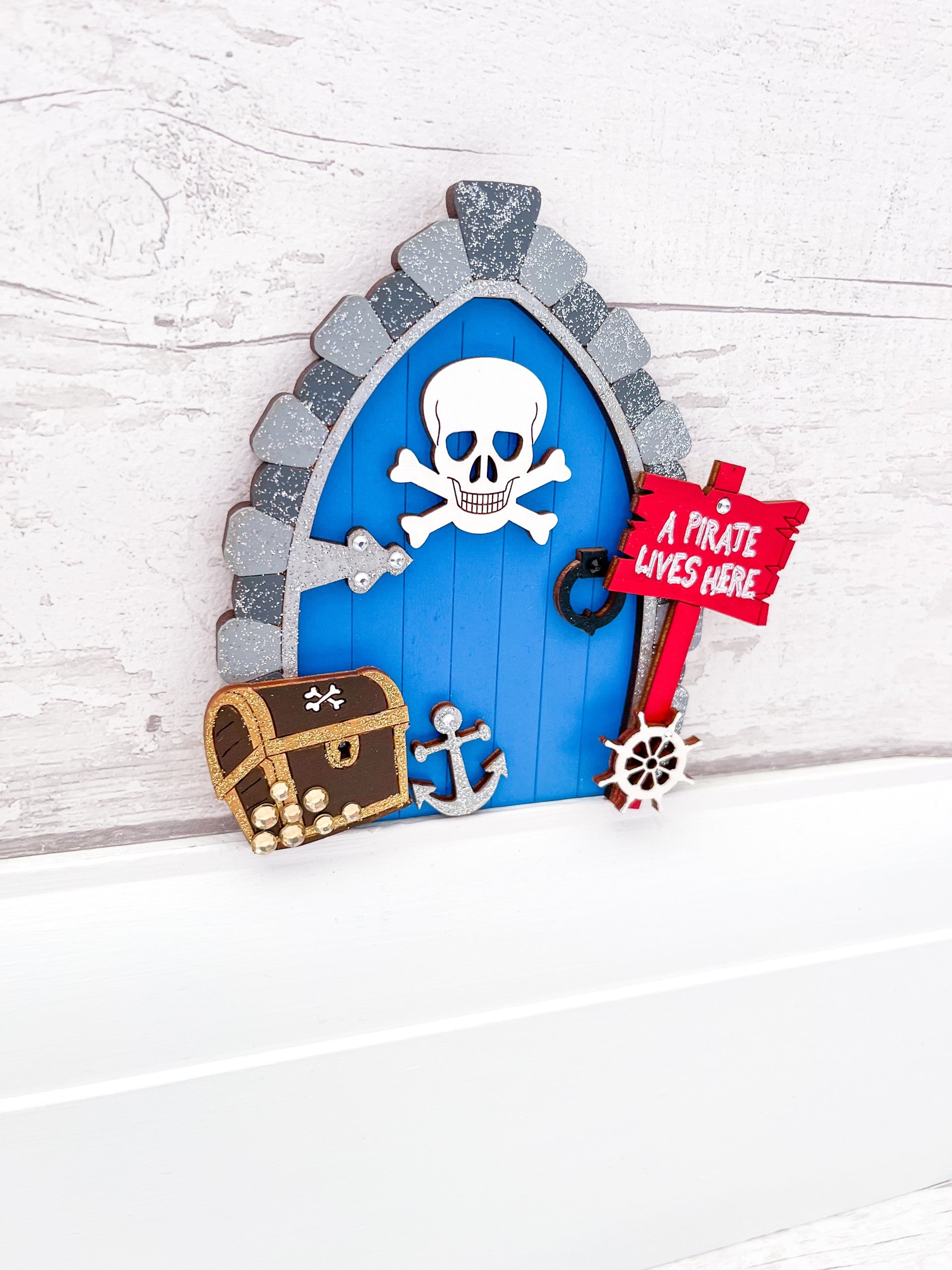 Handcrafted wooden fairy door with a pirate twist, perfect for adventurous little ones - Sweet Pea Wooden Creations