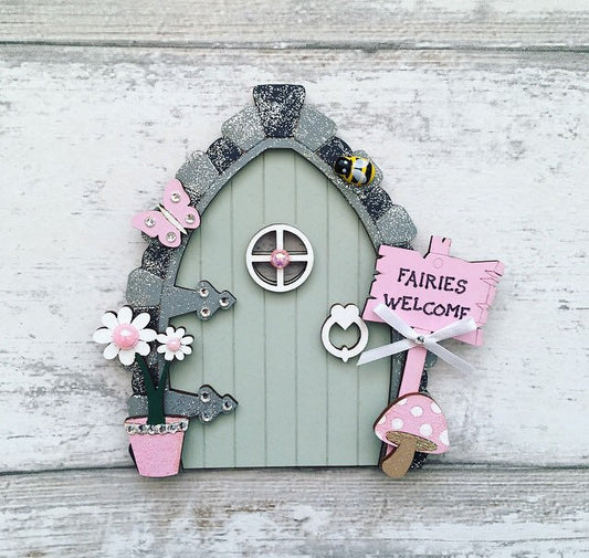 Beautiful Sage Green & Pink Wooden Fairy Door  Invite some fairy magic into your home and capture your child's imagination with this beautiful handmade wooden fairy door.